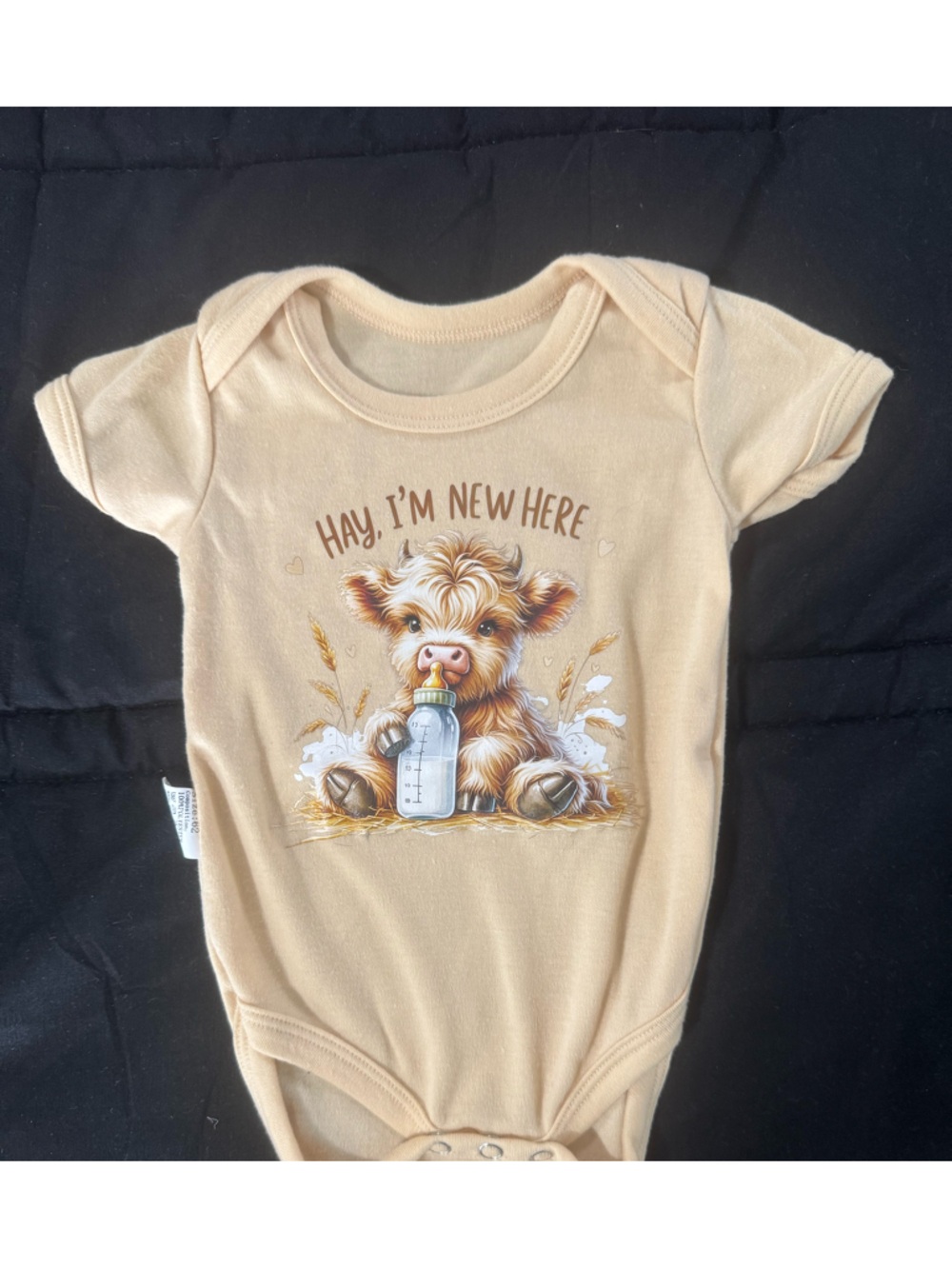 Hay I'm New Here Beige Baby Onesie with Calf Graphic